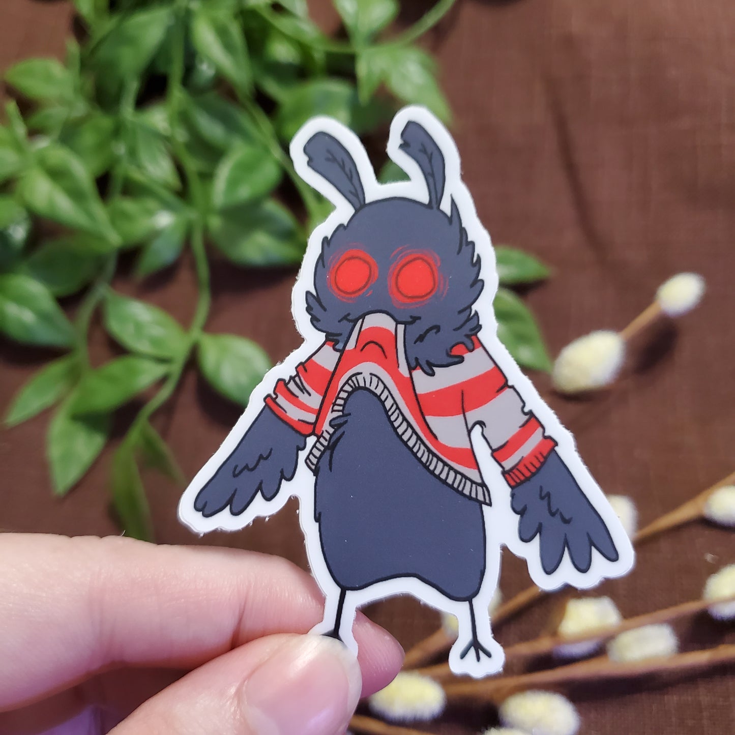 Mothman Eating His Own Sweater Sticker