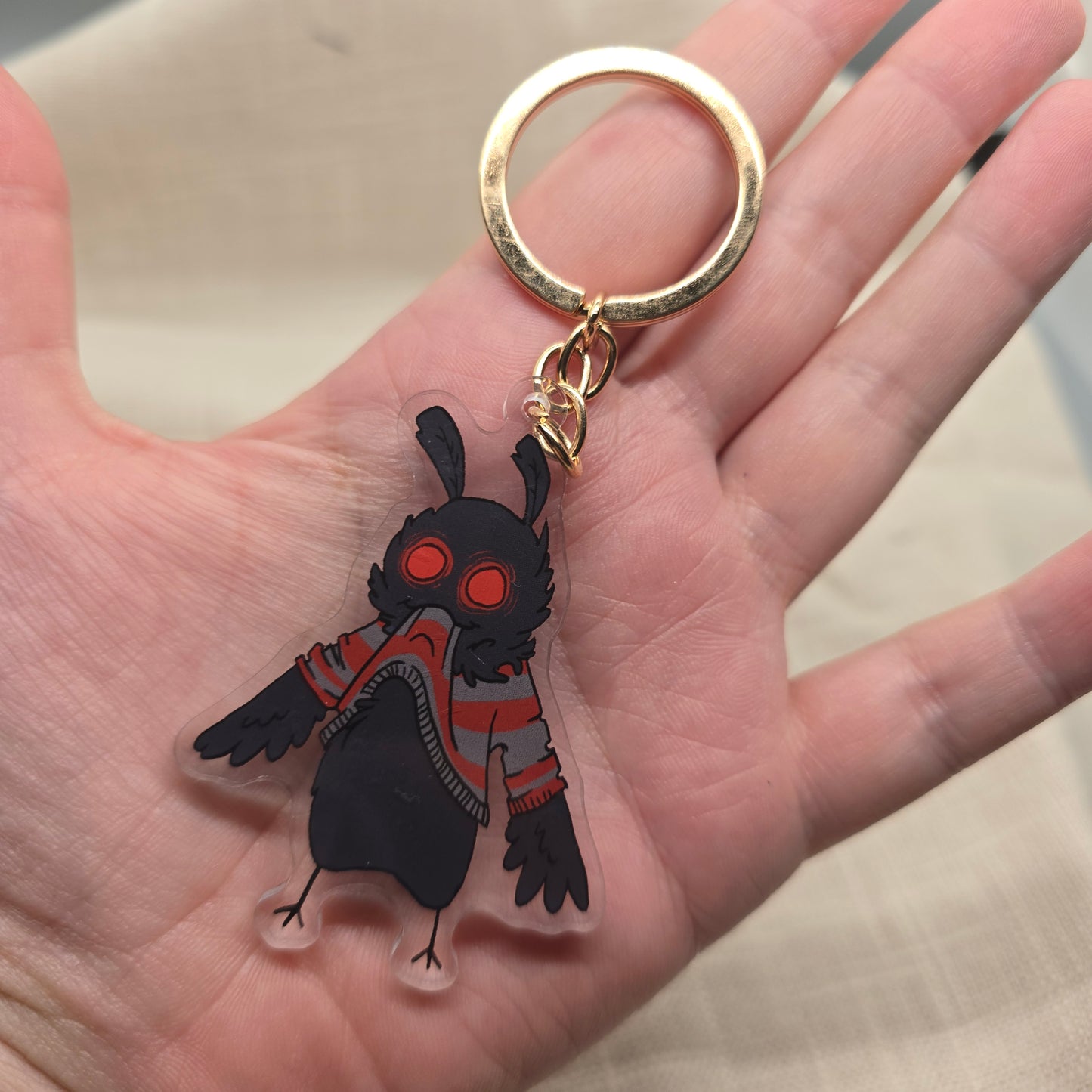 Mothman Eating His Own Sweater Keychain Charm