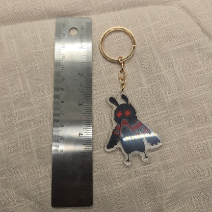 Mothman Eating His Own Sweater Keychain Charm